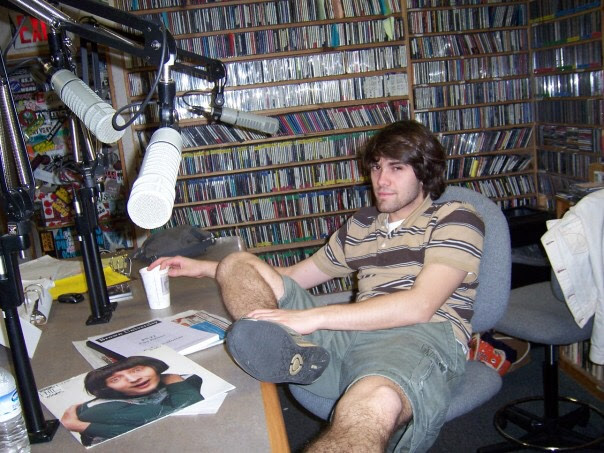 Ryan Mott, DJ Sauce, seated in the 95.5 WBRU studio in 2008